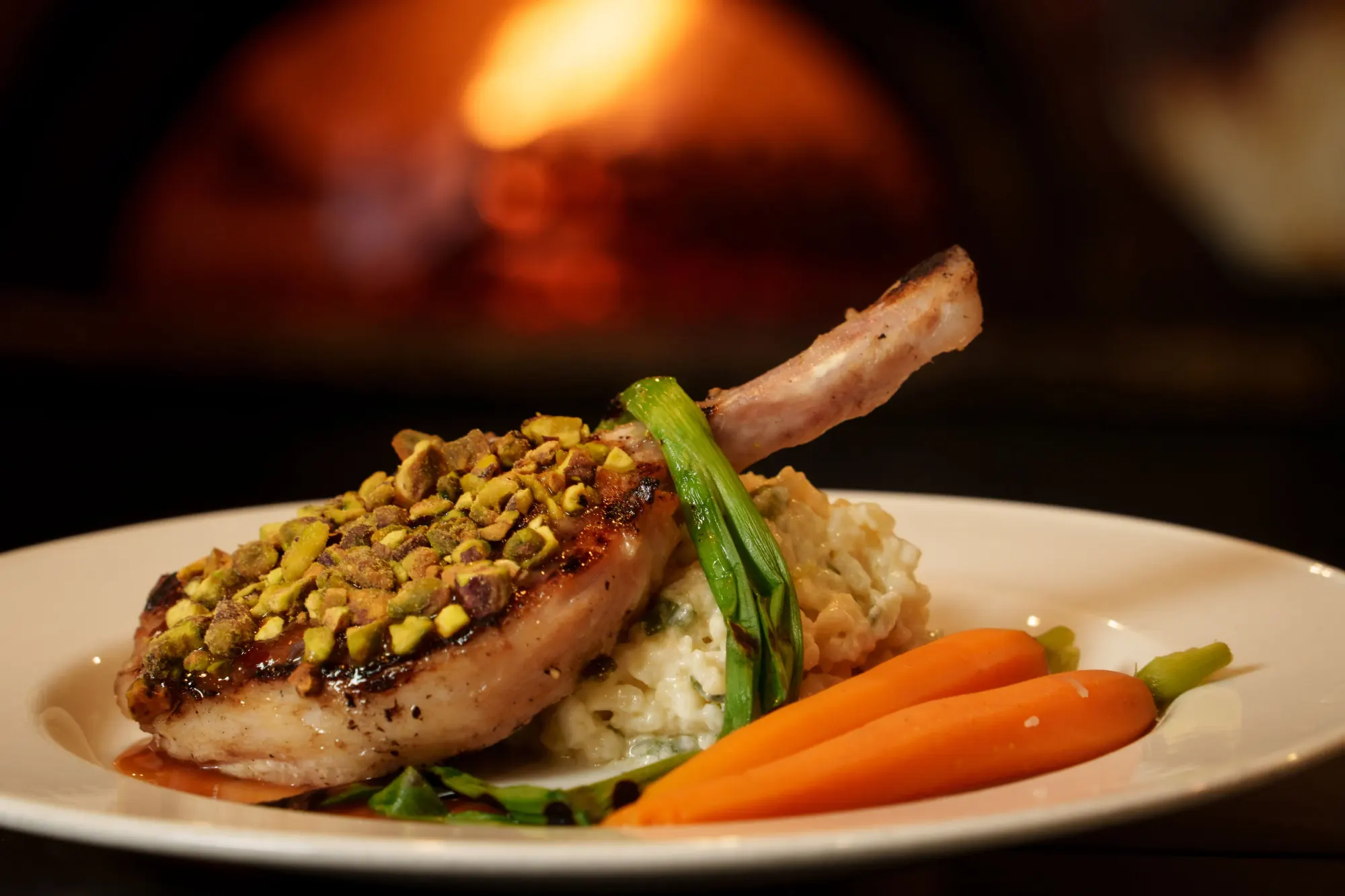 Pistachio-crusted pork rib chop at 240 Union in Lakewood, Colorado