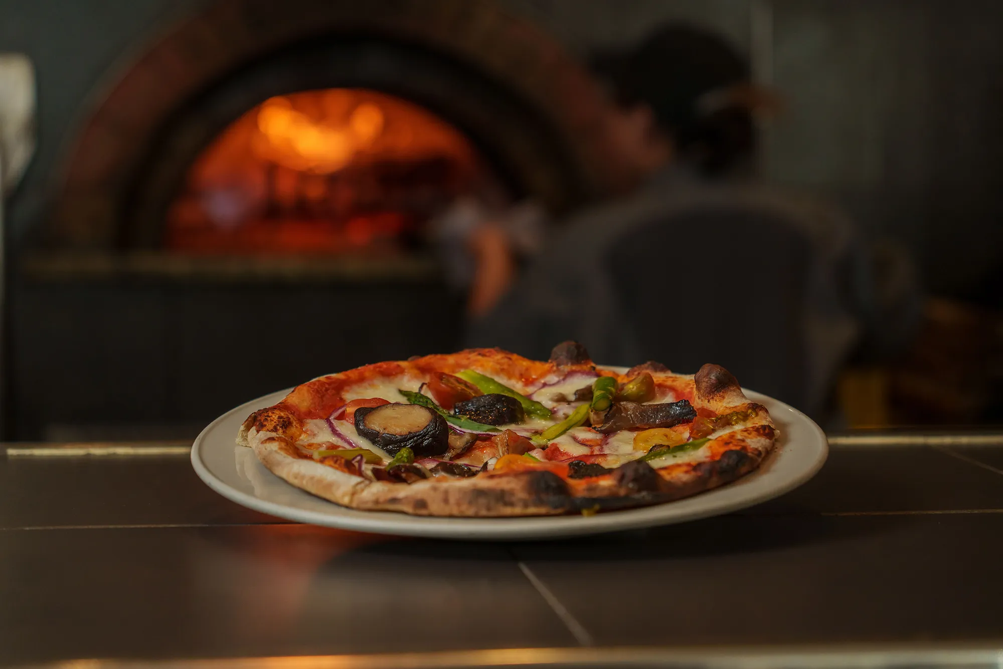 A wood-fired pizza at the oven at 240 Union in Lakewood, Colorado